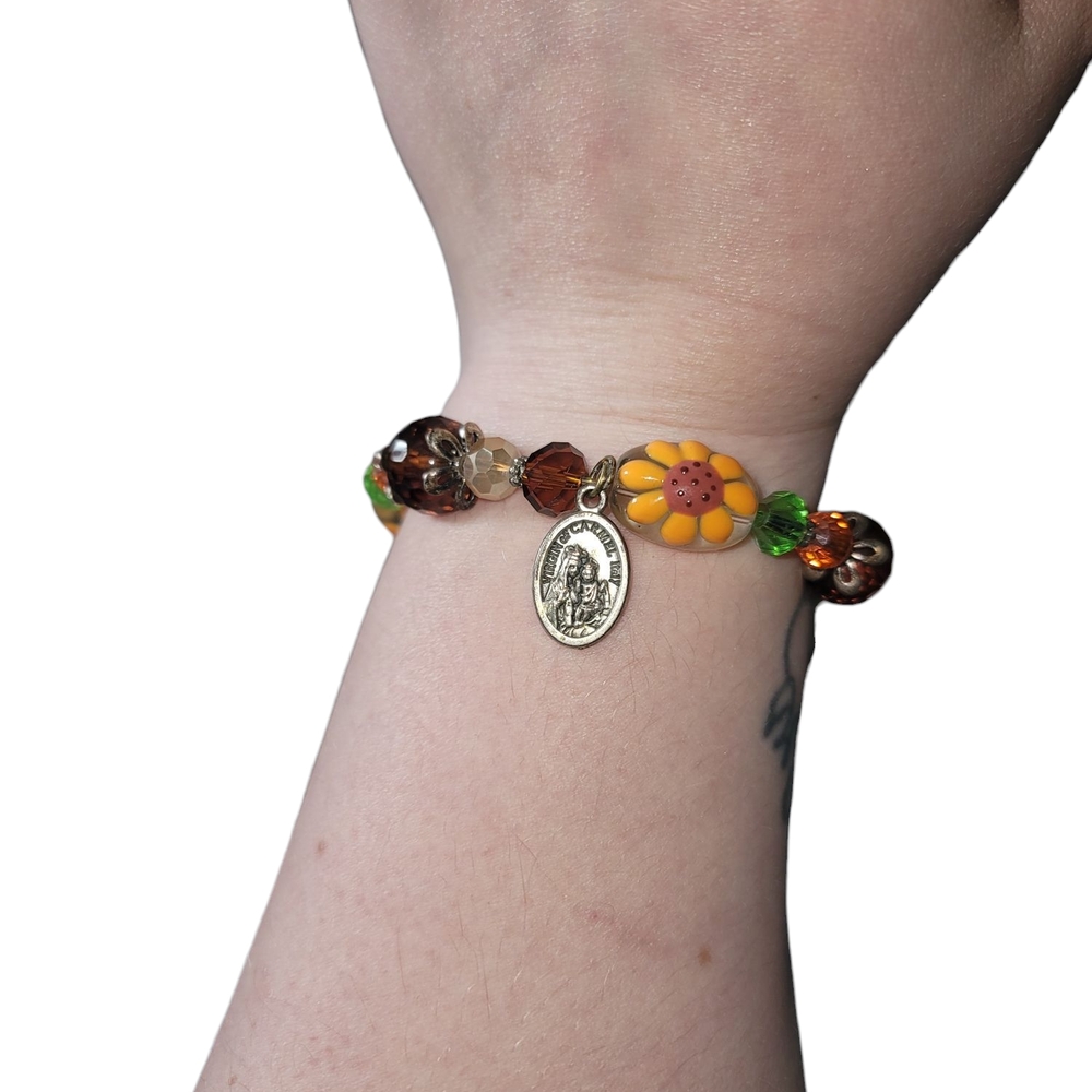 Yellow and Brown Beaded Bracelet with Metallic Charm